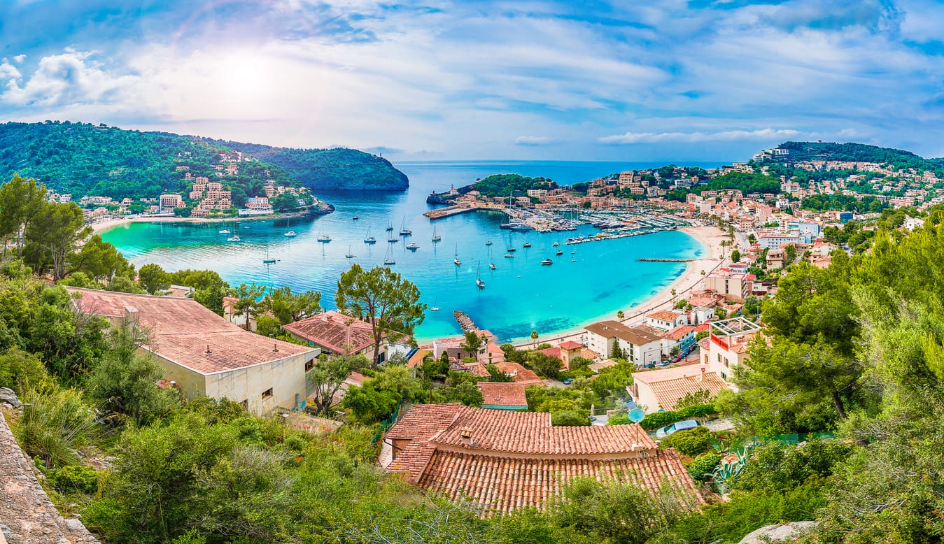 Panoramic view of Porte de Soller, Palma Mallorca, Spain - Coastal view of Mallorca Spain with cliffs, turquoise sea, and terracotta rooftops
